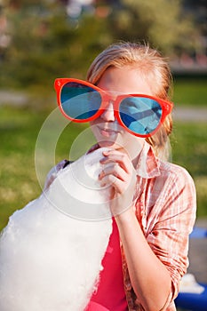Girl eating cotton candy