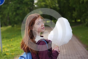 Girl eating cotton candy