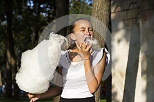 Girl eating cotton candy