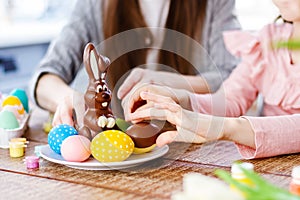 Girl eating delicious chocolate rabbit