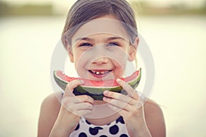 Girl eating fresh watermelon.Summer joy sweet red watermelon