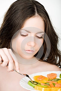 Girl eating fruits