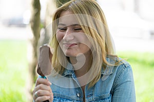 Girl eating ice cream and enjoy the summer outdoor