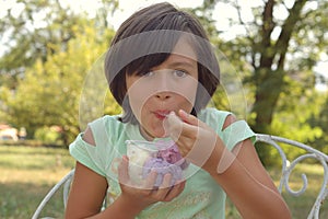 Girl eating ice cream from tub