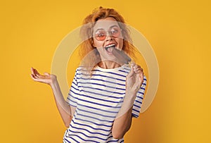 girl eating icelolly ice cream at summer. girl with icelolly ice cream isolated on yellow. girl with icelolly ice cream