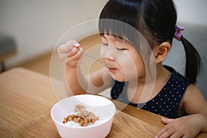 Girl eating natto rice