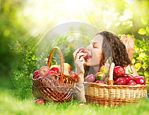 Girl Eating Organic Apple in the Orchard