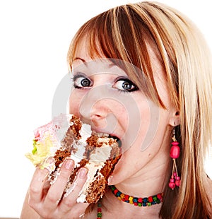 Girl eating piece of cake.