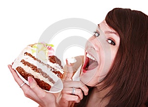 Girl eating piece of cake.