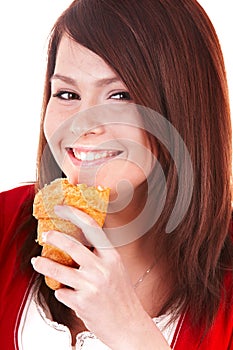Girl eating piece of cake.