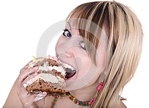 Girl eating piece of cake.