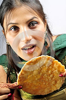 Girl eating poppadom