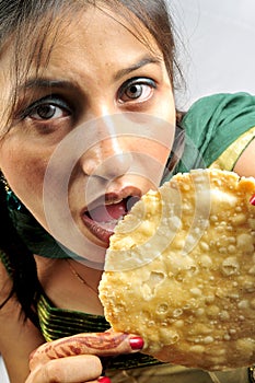 Girl eating poppadom