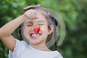 Girl eating strawberries