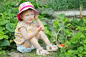 Girl eating strawberries