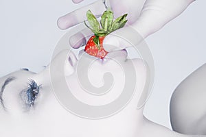 Girl eating a strawberry