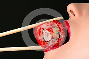 girl eating sushi roll, sensual red lips