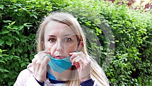 Girl Eating A Sweet Stick In A Protection Mask
