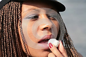 Girl eating sweetmeat photo