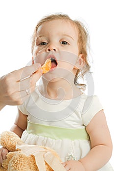 Girl eating tangerine
