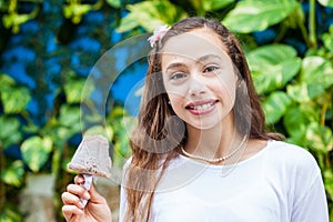 Girl eating a traditional water ice cream typical of the Valle del Cauca region in Colombia