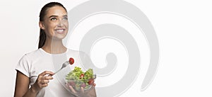 Girl Eating Vegetable Salad From Bowl Standing, White Background, Panorama