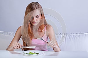 Girl eating very small lunch