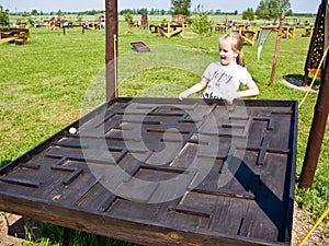 Girl and educational toy outdoors