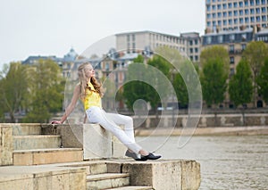 Girl on the embankment in Paris
