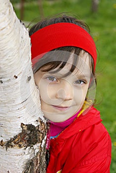 The girl embraces a birch photo