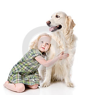 Girl embraces a Golden Retriever.