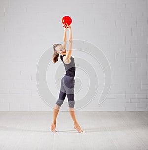 Girl is engaged in art gymnastics