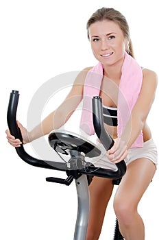 The girl is engaged on a velosimulator