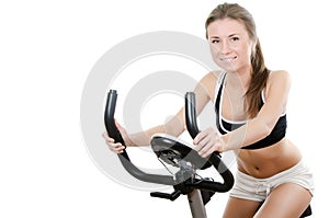 The girl is engaged on velosimulator