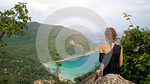 Girl enjoy picturesque view of the island at a height