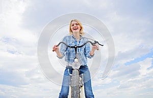 Girl enjoy short cycle tour with stop offs along way and travel. Woman likes to ride bike. Girl holds handlebar of bike