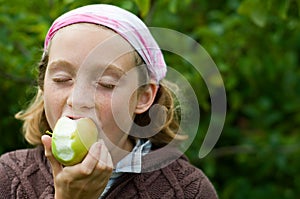 Girl enjoying an apple