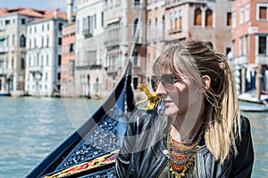 Girl enjoying gondola ride in Venice