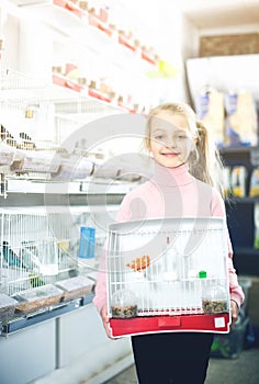 Girl enjoying her purchase of canary bird