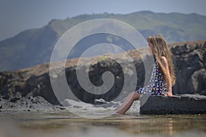 girl enjoying natural pools to quell the heat due to climate change