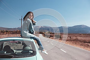 Girl enjoying road trip