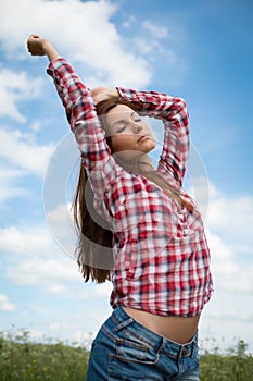 Girl enjoying the summer wind