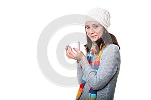 Girl enjoys her cup of tea on white background