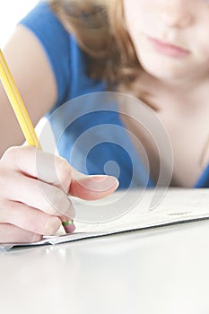 Girl erasing mistake with homework