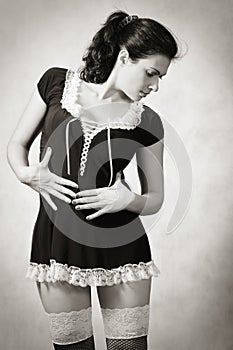 Girl in erotic maid costume