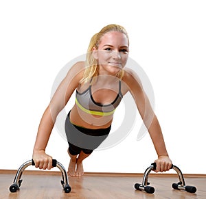 Girl during exercise pectoral muscles on white background. photo