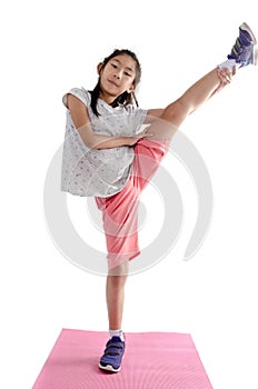 Girl exercise on yoga mat with white background..