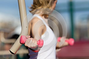Girl exercising with dumbbells
