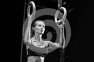 Girl exercising with gymnastic rings