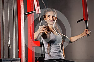 Girl exercising at a sports simulator.